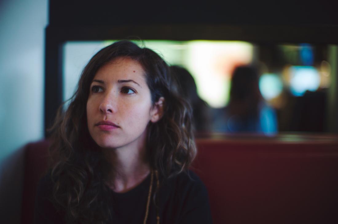woman gazing pensively into the distance