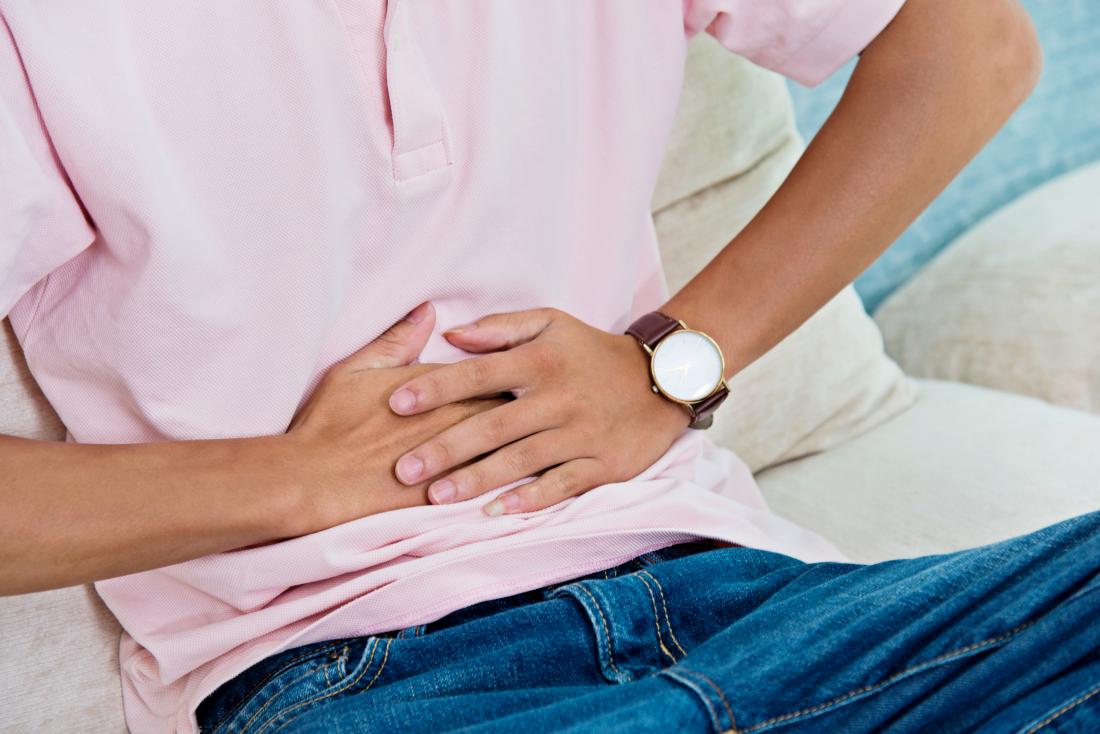 man holding his stomach