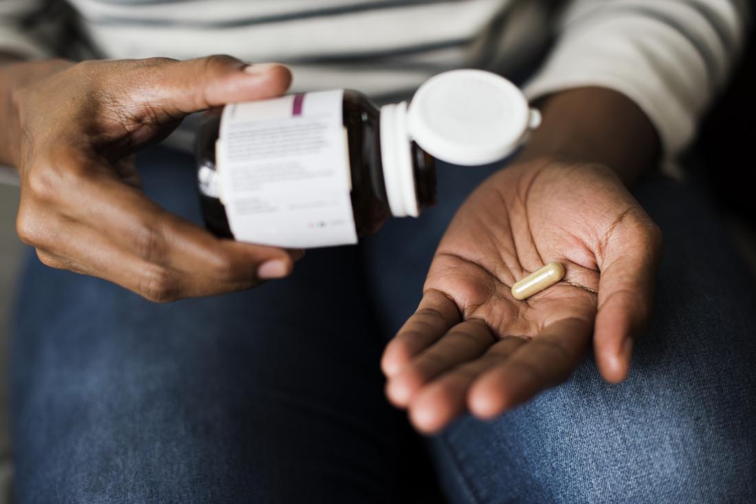 person holding collagen supplements
