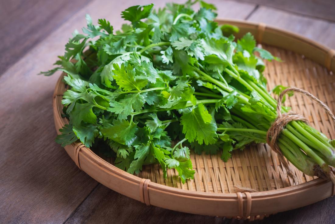 cilantro on a wooden plate