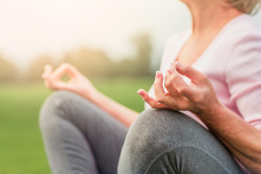 close up of a senior lady meditating
