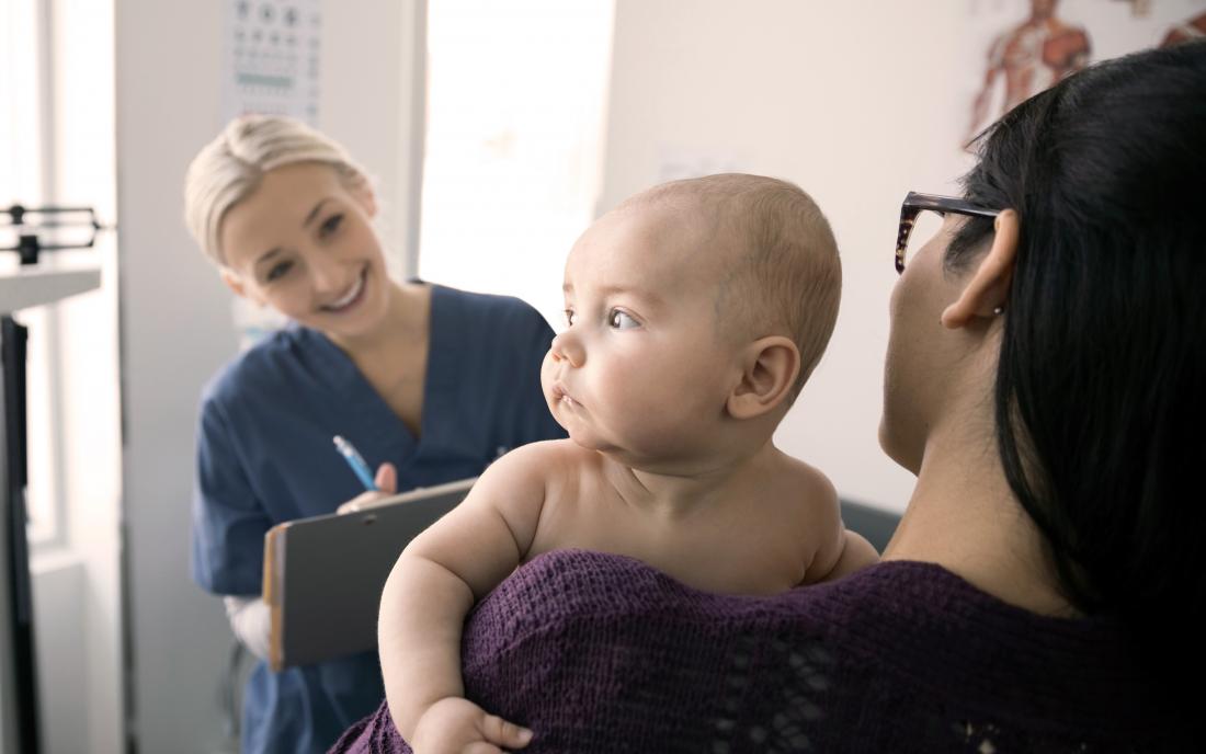 a woman taking her baby to a doctor to ask if it's ok to give melatonin to babies