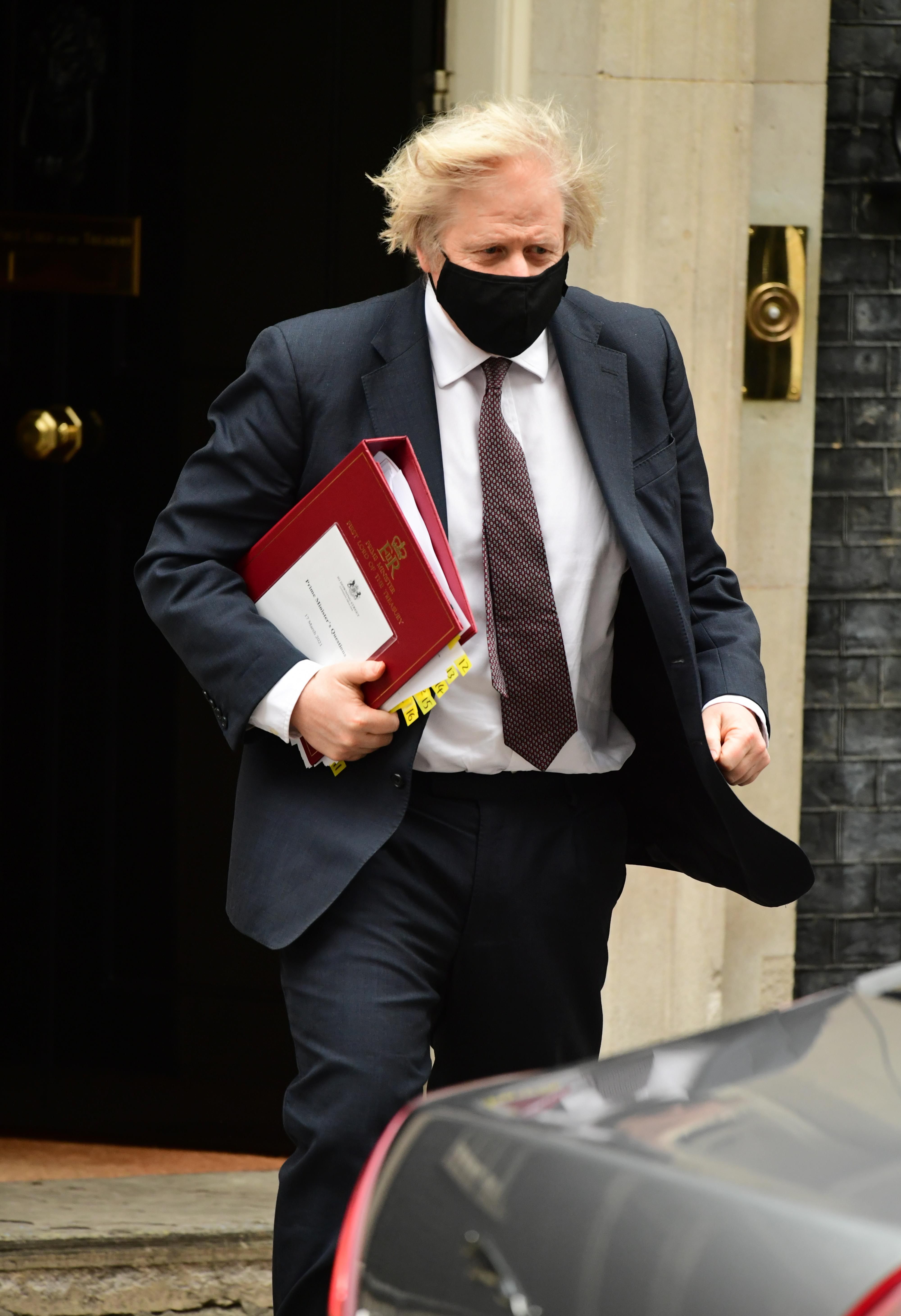 Prime Minister Boris Johnson leaves 10 Downing Street to attend Prime Minister's Questions at the Houses...