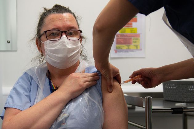 A nurse is given the Oxford/AstraZeneca Covid-19 vaccine in Coventry on January