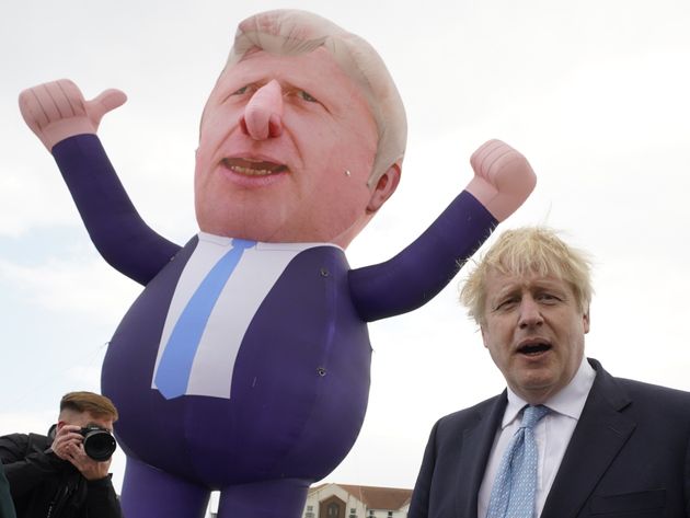 Boris Johnson in front of a giant inflatable of himself as he meets and newly elected Tory MP Jill Mortimer...