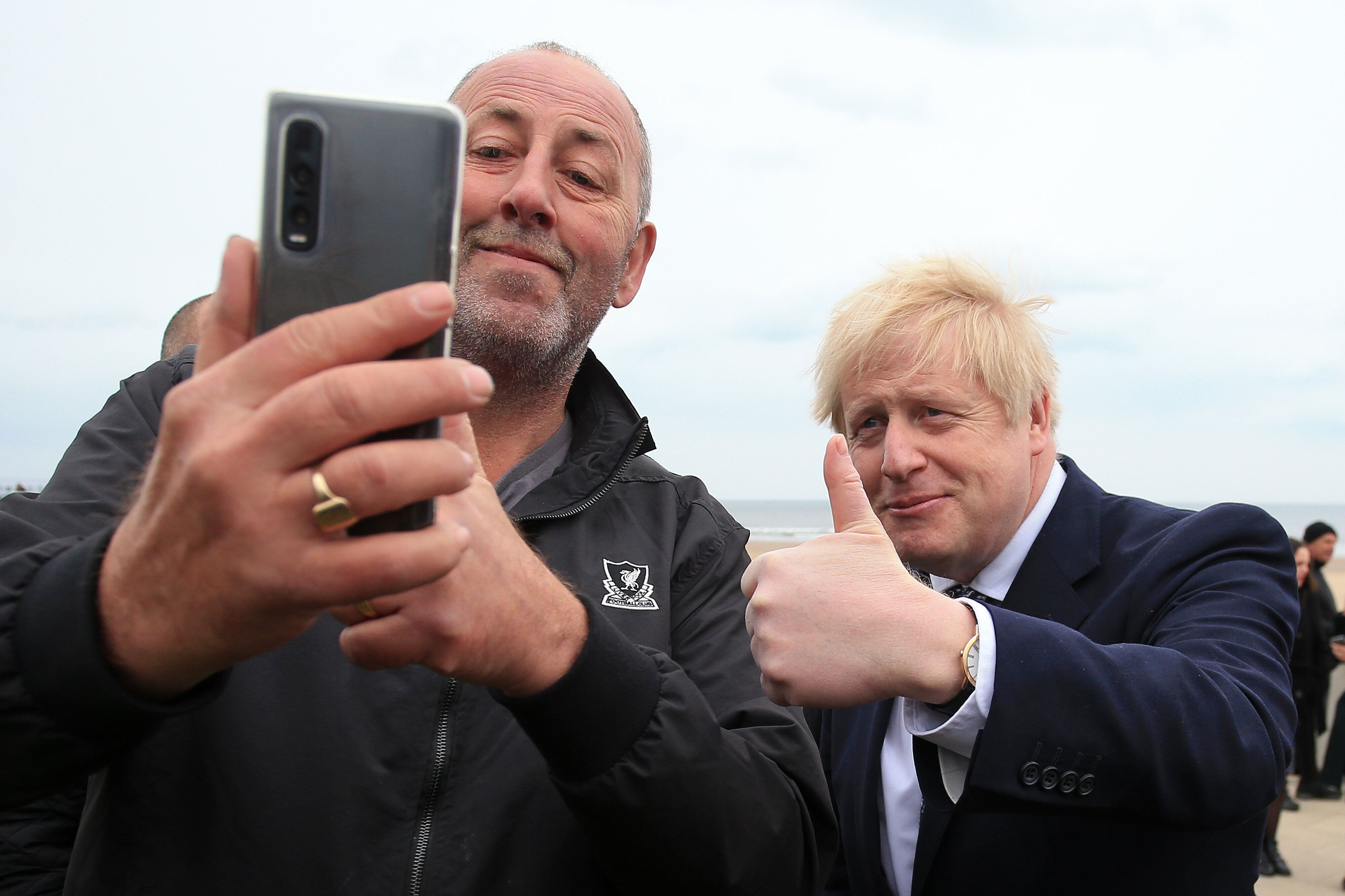 Boris Johnson poses for a 'selfie' photograph as he meets members of the public while campaigning in