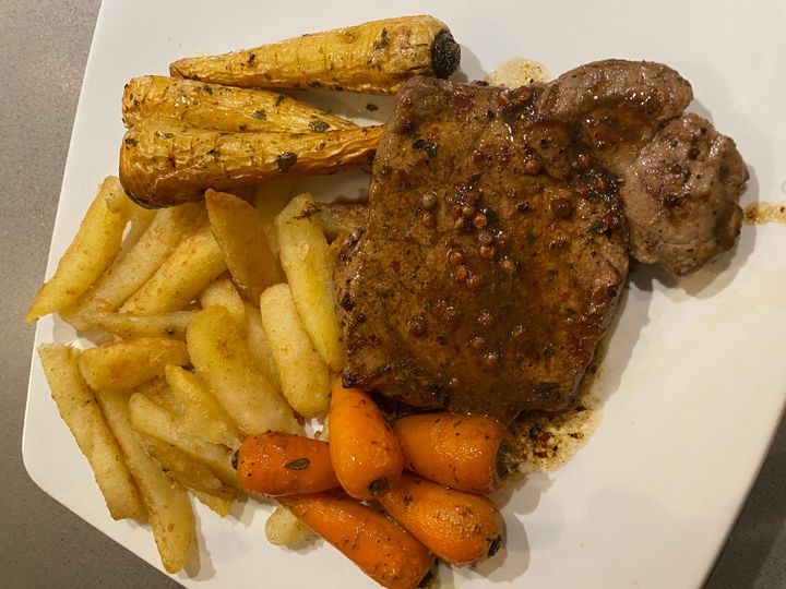 Asda's sirloin steak with honeyed baby parsnips and triple-cooked chips.
