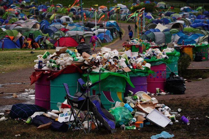 Waste left by festival goers waiting to be cleared at Worthy Farm on the Monday after Glastonbury Festival.