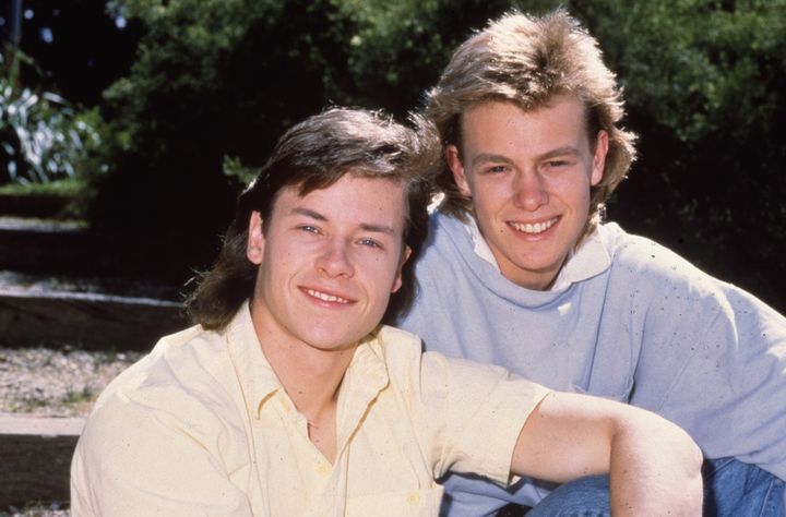 Guy with Jason Donovan, who played Scott Robinson, back in the 1980s