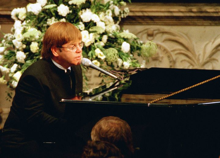 Elton performing a rewritten version of his song Candle In The Wind as a tribute to Diana, Princess of Wales, at her funeral