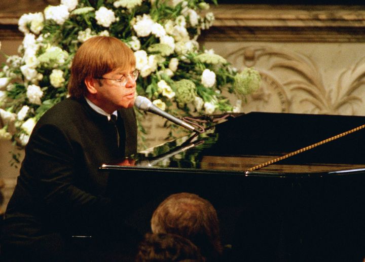 Elton performing a rewritten version of his song Candle In The Wind as a tribute to Diana, Princess of Wales, at her funeral