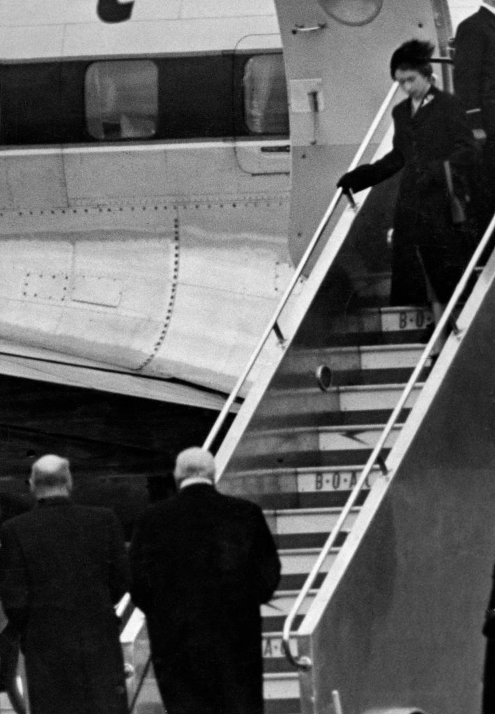 Elizabeth II sets foot on British soil for the first time since her accession as she lands in Britain, following the death of her father. Waiting for her at the bottom of the plane steps are Clement Attlee and then prime minister Winston Churchill