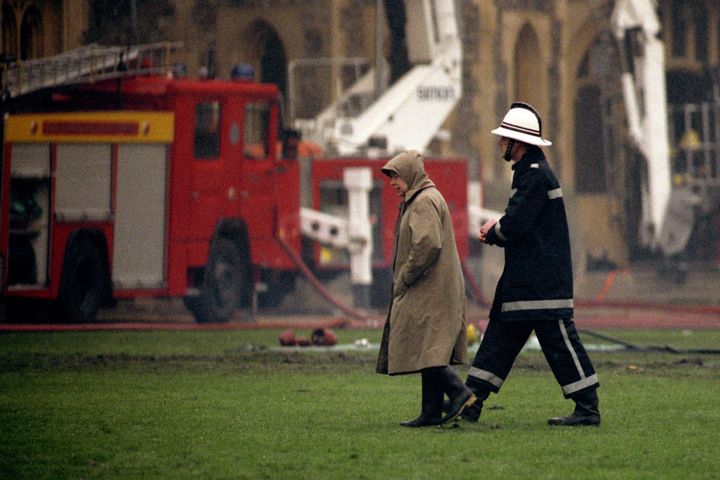 The Queen surveying the scene at Windsor Castle following the fire in 1992