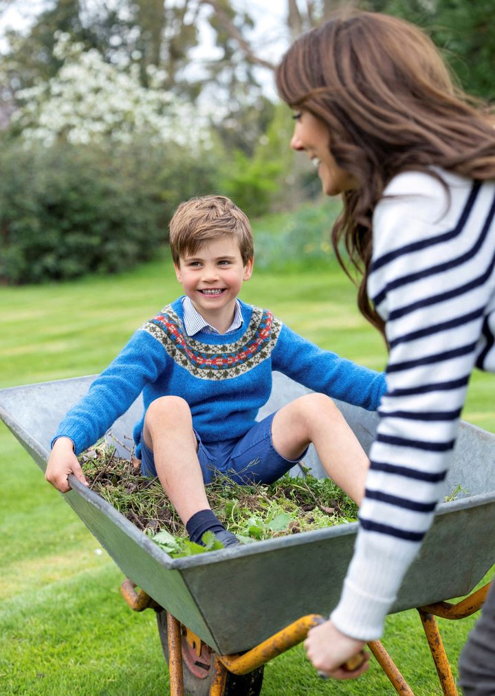 Prince Louis is seen in a portrait being pushed in a wheelbarrow by his mother, the Princess of Wales, in a photo issued by Kensington Palace on April 22. 