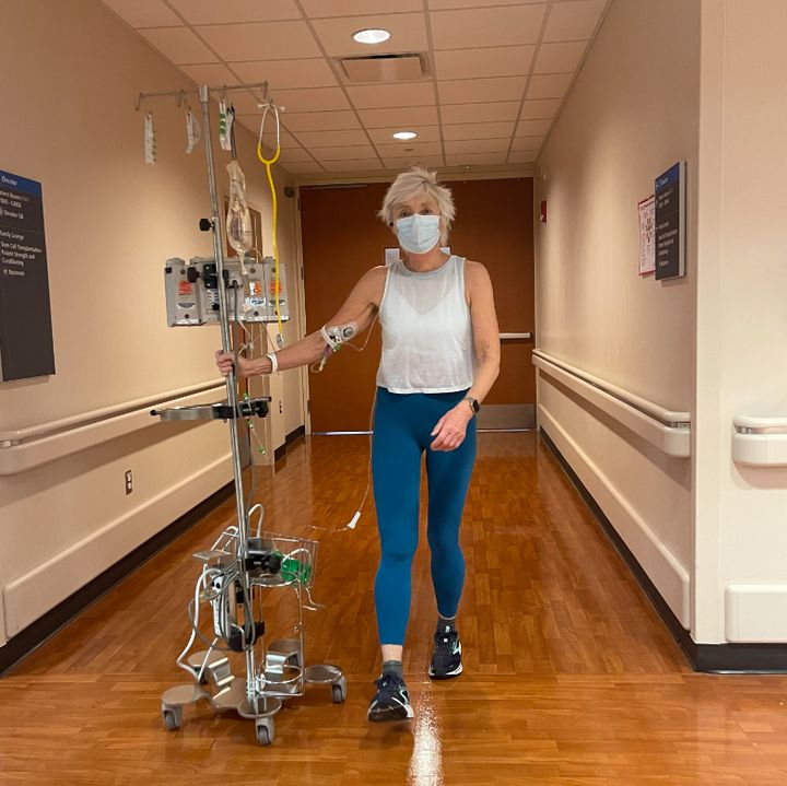 The author power-walking with her IV pole, nicknamed Slim, during her MD Anderson treatment.