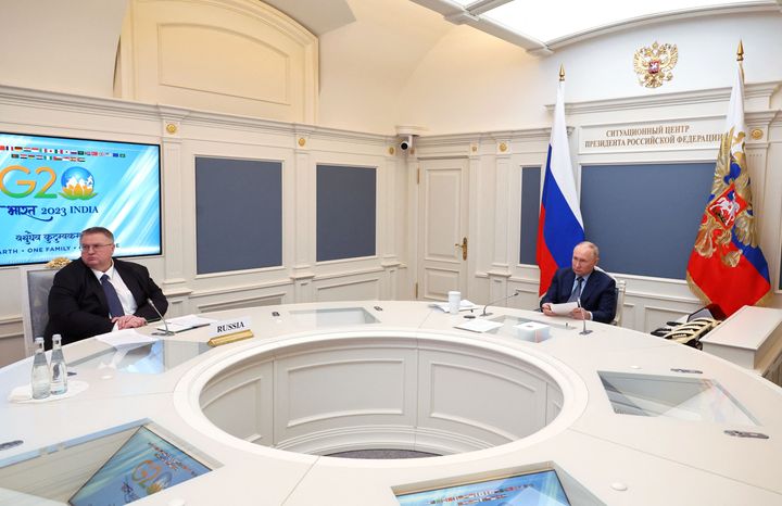 This pool photograph distributed by Russian state agency Sputnik shows Russia's President Vladimir Putin taking part in a virtual G20 leaders' summit in Moscow on November 22, 2023.