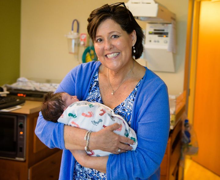 The author's mother holds the author's daughter a few minutes after she was born in August 2018. "It is one of the few pictures I have of them together," the author writes. "My mom's health declined quickly, and she died four months later."