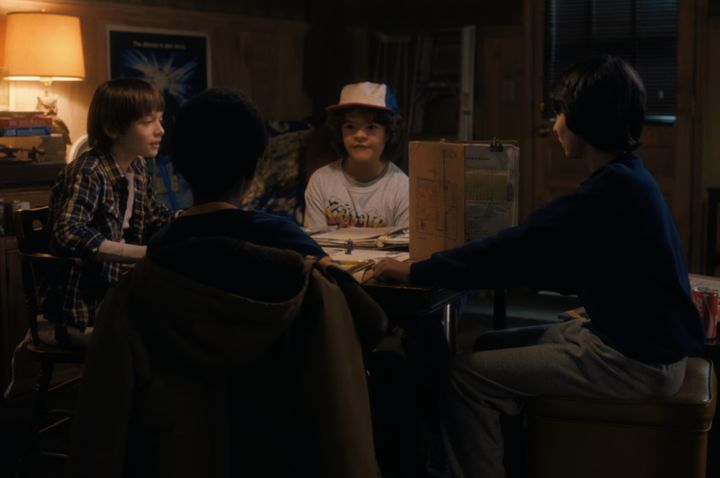 The young friends playing a D&D campaign in the first ever episode