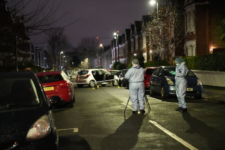 Police at the scene in Lessar Avenue near Clapham Common, south London, where a woman and her two young children have been taken to hospital after a man threw a suspected corrosive substance on Wednesday evening. 