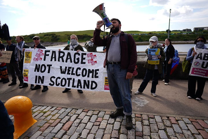 Protesters gather at a press conference attended by the Reform UK leadership in Aberdeen.