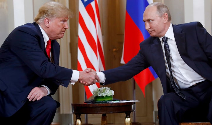 Not so chummy now: Trump, left, and Putin in 2018. 