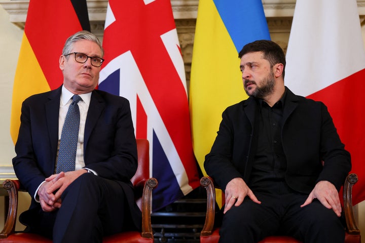 Ukrainian President Volodymyr Zelenskyy, right, attends meeting with German Chancellor Friedrich Merz, British Prime Minister Keir Starmer, and French President Emmanuel Macron at 10 Downing Street, in London, Monday, Dec. 8, 2025. (Toby Melville/Pool Photo via AP)