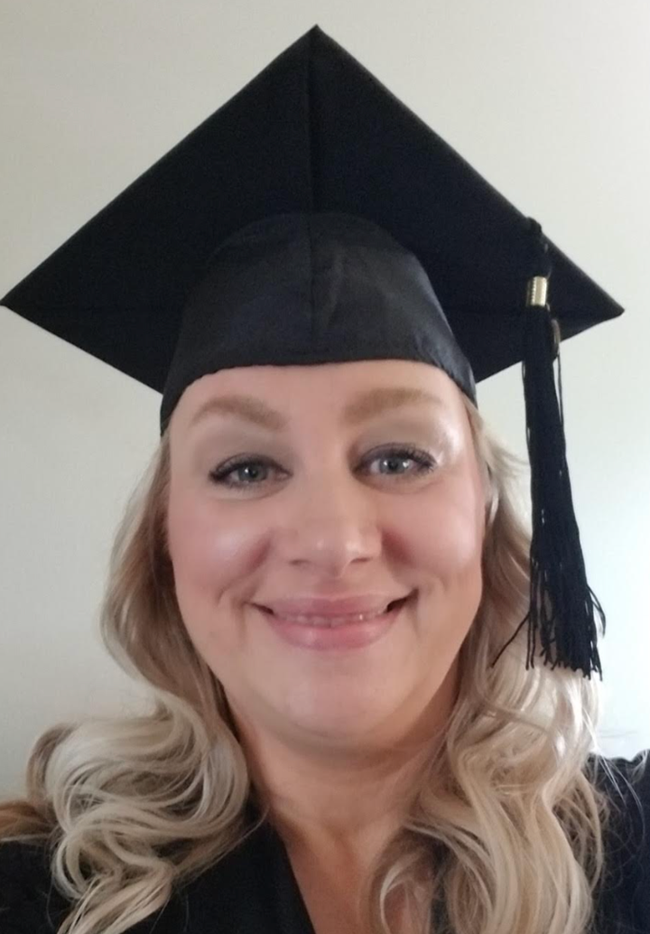 "This photo is from my hooding ceremony when I received my first masters degree in my 40s."