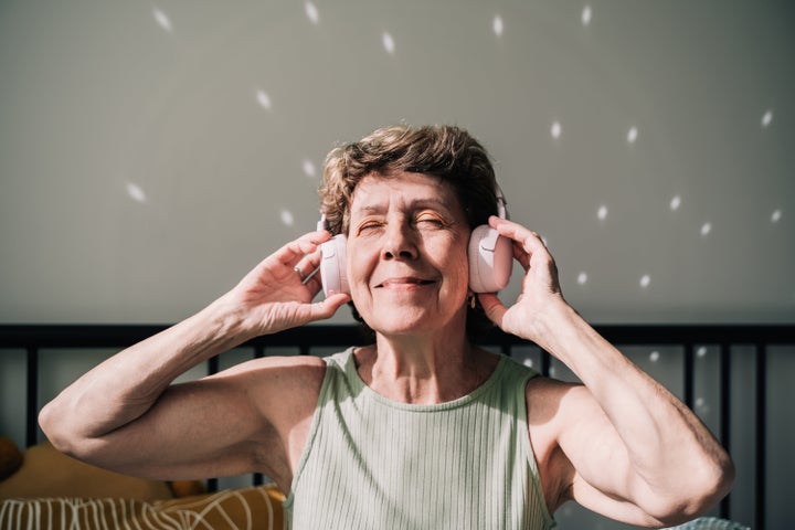 Listening to music or calls through headphones is no more damaging than listening through a computer speaker, according to experts.