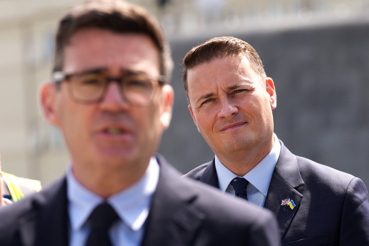 British Prime Minister Andy Burnham, foreground, and Defence Secretary Wes Streeting, right
