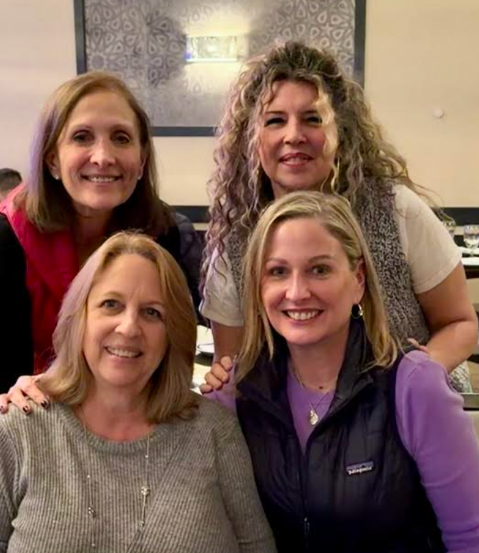 The author (front right) out to dinner with friends. “My friends are all turning 60 this year, including one who told me the goal is to accept the woman you see in the mirror," she writes.
