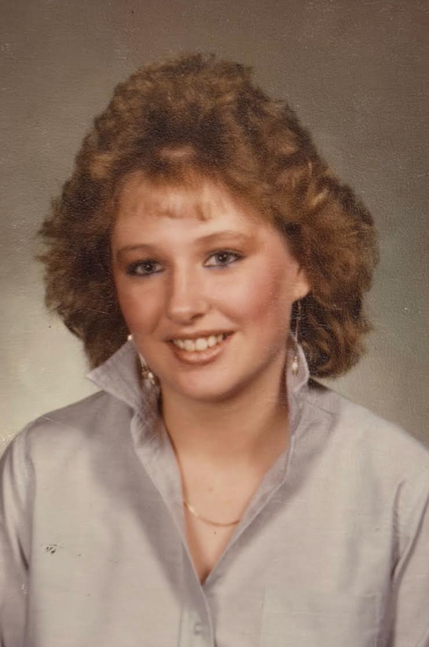 "This is my junior year high school yearbook photo," the author writes. "This was around the time I started believing my nose needed fixing."