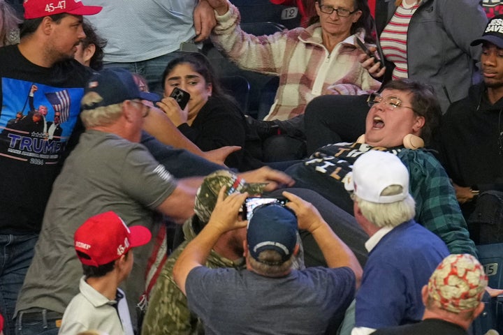 A protester yells before being removed as President Donald Trump speaks at a campaign rally at the Covelli Centre in Youngstown, Ohio.