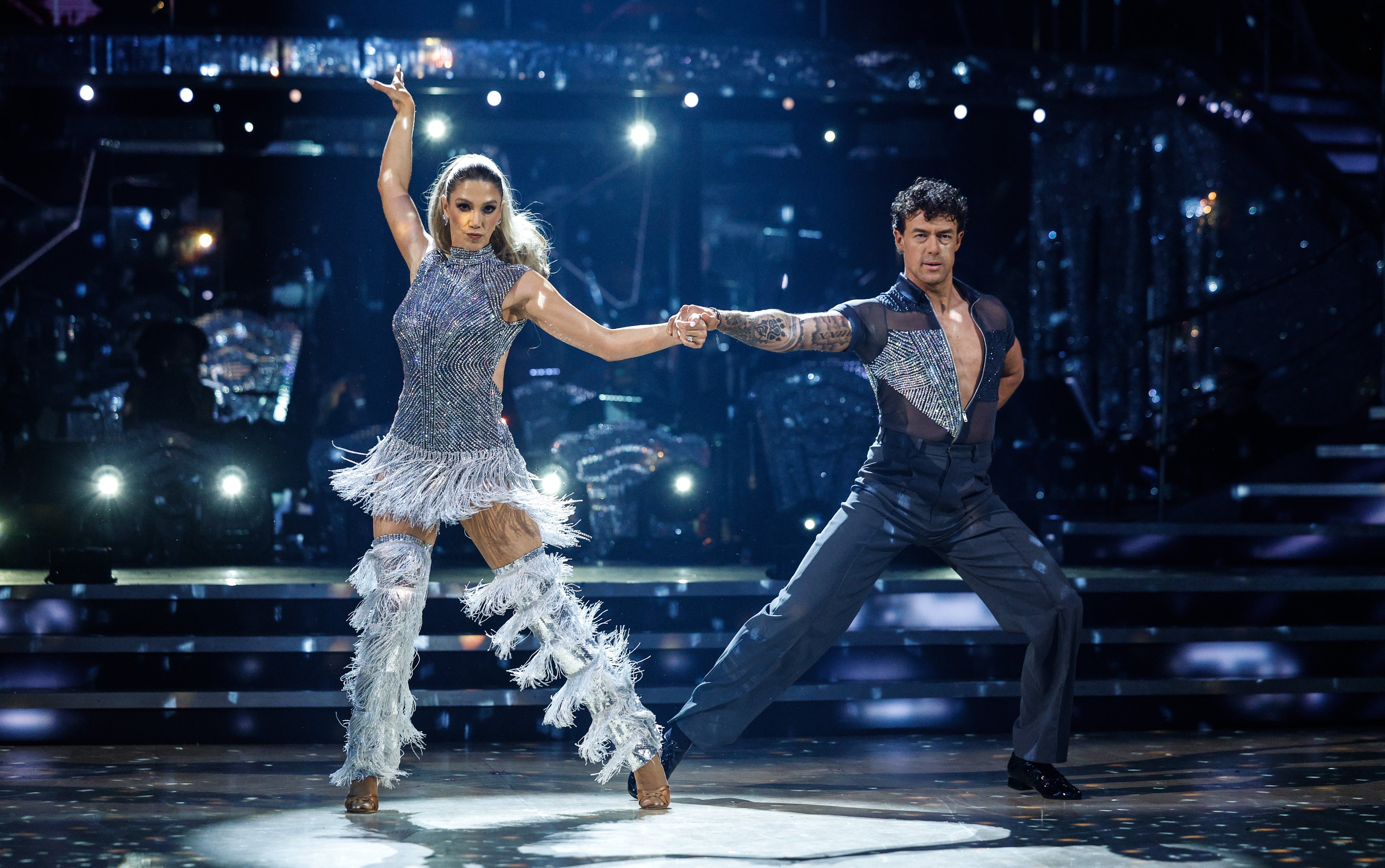 Delta Goodrem and Kai Widdrington performing a disco-inspired Salsa routine in the Strictly Come Dancing ballroom